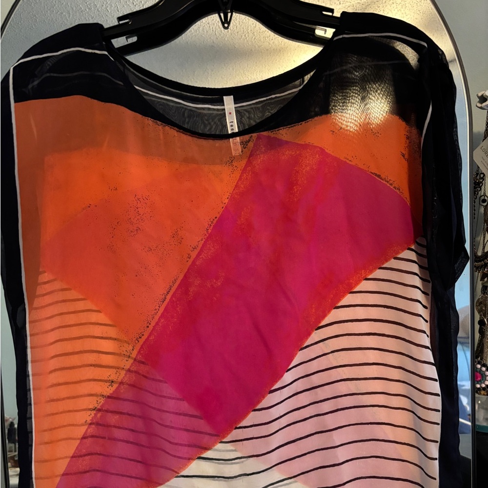 Like new! Sleeveless sheer top!